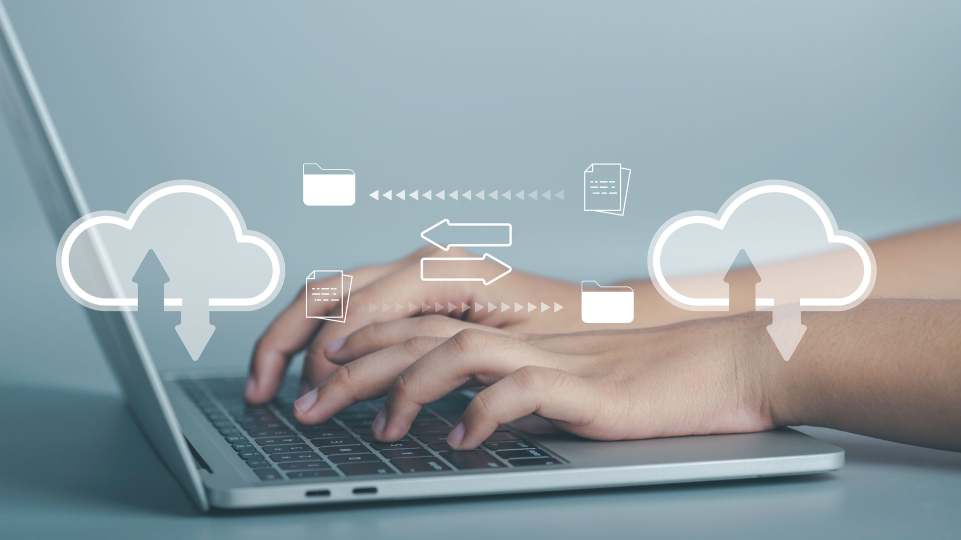 Laptop showing icons of a data exchange.