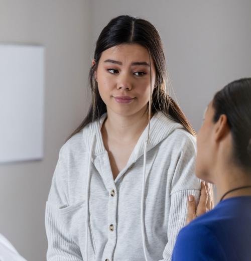 Patient discusses her concerns with nurse.